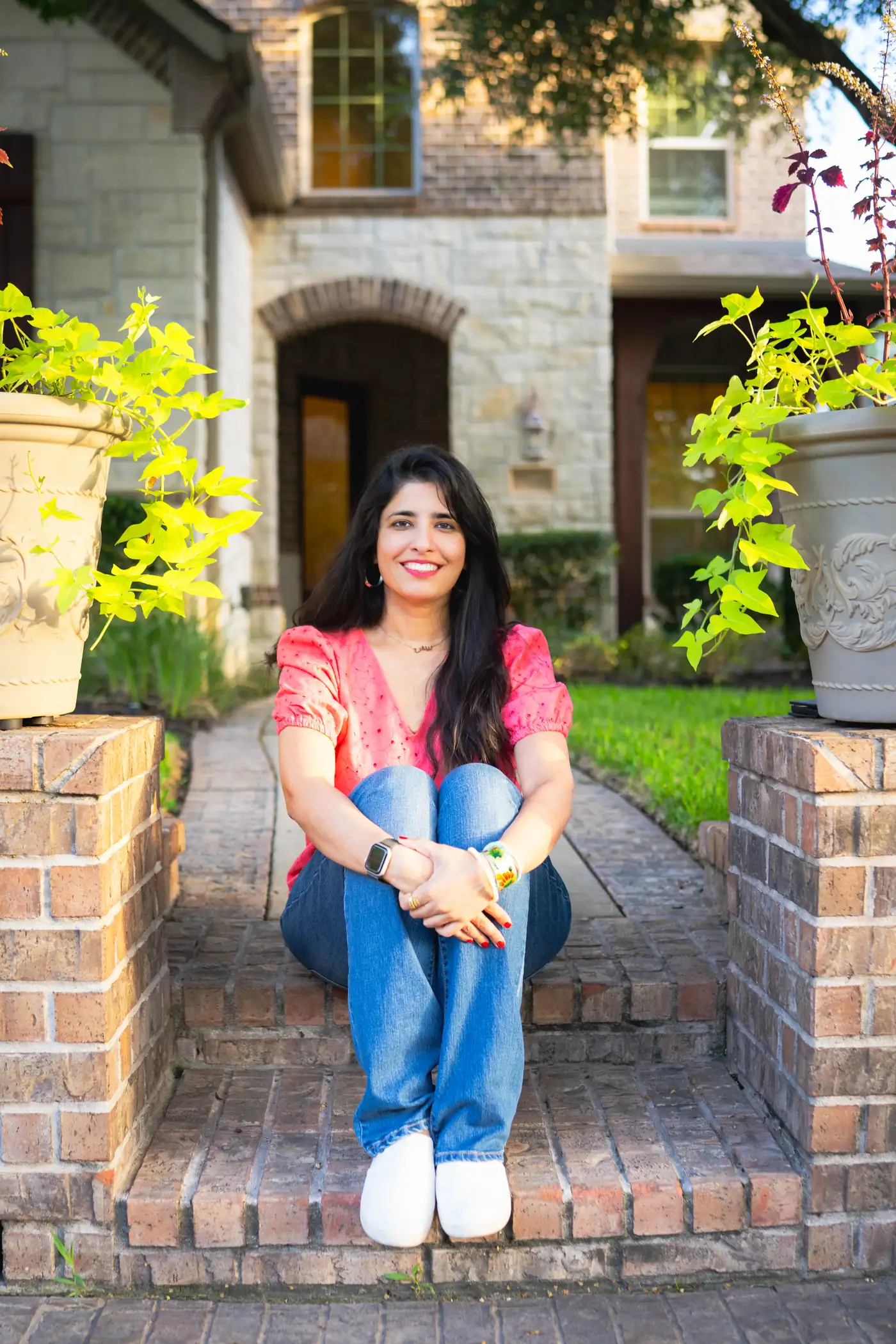 Beenish Hussain in a pink top outdoors